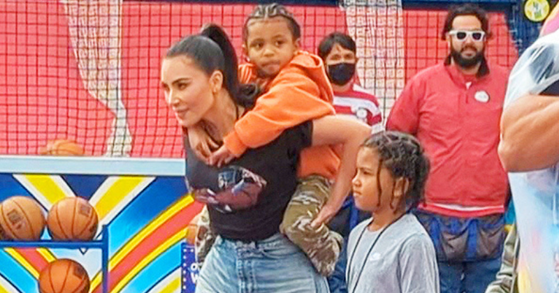 Kim Kardashian Takes Son Psalm to Universal Studios, Carrying Him on Her Back While Enjoying a Fun Day Kim Kardashian carries son on her back