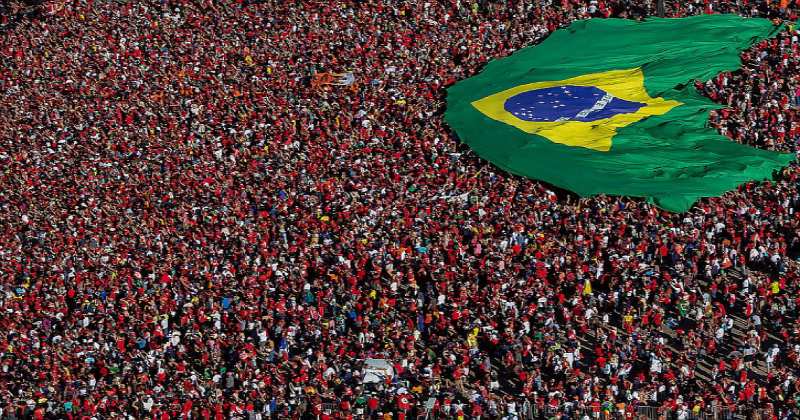 Brazilians Gather and Display a Brazilian Flag During the Presidential Inauguration Ceremony in Brasilia on New Years Day 2023