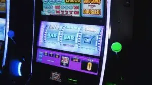 Slot game with lever and traditional reel